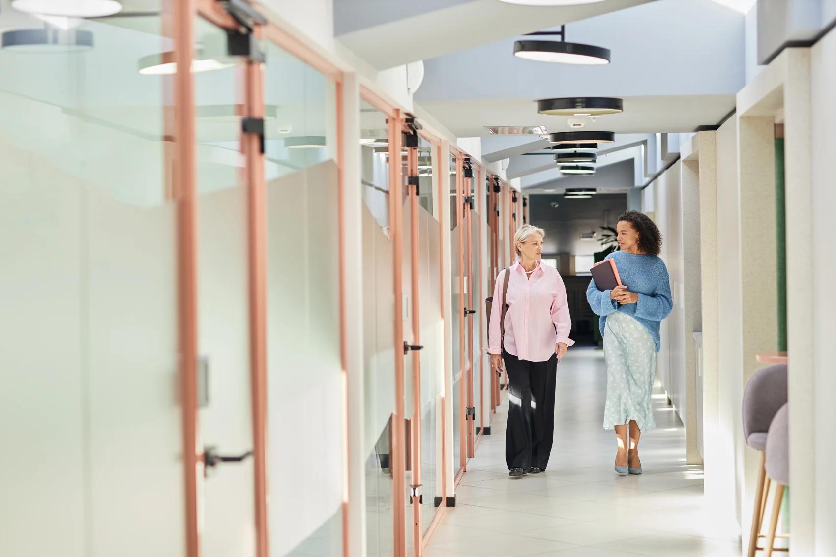 Female coworkers talking on Business Operations Services