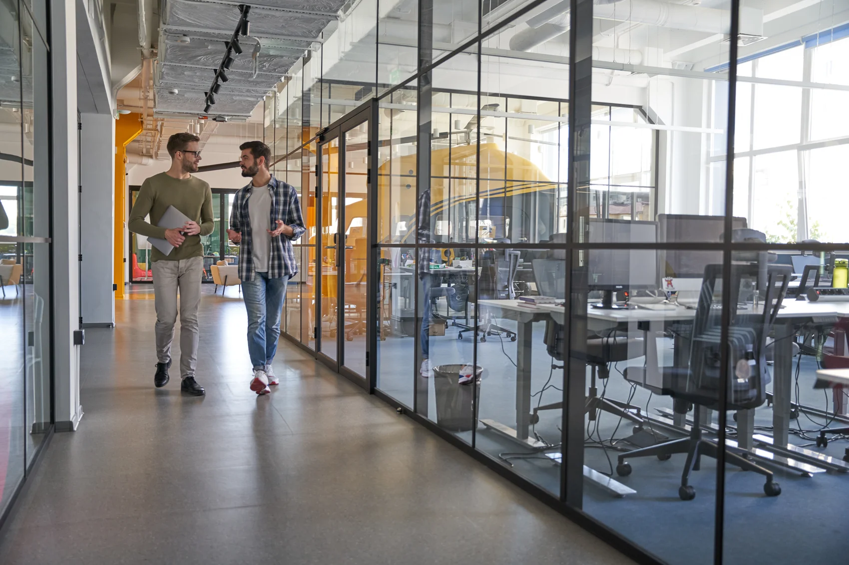 Workers discussing a new business project in a modern office